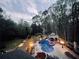 Scenic aerial view of backyard pool with lush landscaping at 1886 Chedworth Ct, Stone Mountain, GA 30087