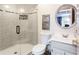Modern bathroom with glass shower, stylish toilet and a vanity with round mirror at 1886 Chedworth Ct, Stone Mountain, GA 30087