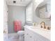 Bright bathroom with a marble countertop, modern white vanity, and gold fixtures at 1886 Chedworth Ct, Stone Mountain, GA 30087