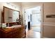 Bathroom vanity with wood drawers and mirror, with a view to the outside at 1886 Chedworth Ct, Stone Mountain, GA 30087