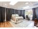 Comfortable bedroom features a nice window view, and curtains that create a cozy vibe at 1886 Chedworth Ct, Stone Mountain, GA 30087