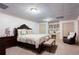 Spacious bedroom featuring a large bed, adjacent desk, and comfortable chair at 1886 Chedworth Ct, Stone Mountain, GA 30087