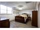 Cozy bedroom with hardwood floors, warm lighting, and traditional furniture at 1886 Chedworth Ct, Stone Mountain, GA 30087