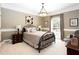 Charming bedroom with neutral walls, decorative pillows, and ample natural light from the large window at 1886 Chedworth Ct, Stone Mountain, GA 30087