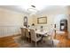 Dining room features modern chandelier, neutral walls and wainscoting at 1886 Chedworth Ct, Stone Mountain, GA 30087
