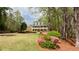 Charming two-story home with a manicured lawn and beautiful landscaping at 1886 Chedworth Ct, Stone Mountain, GA 30087