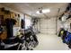 Spacious garage with overhead storage and room for a motorcycle or other hobbies at 1886 Chedworth Ct, Stone Mountain, GA 30087