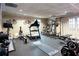 Well equipped home gym featuring a treadmill, weight machines, a rowing machine, and free weights at 1886 Chedworth Ct, Stone Mountain, GA 30087