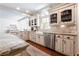 Well-lit kitchen with custom cabinetry, granite countertops, brick flooring, and stainless steel appliances at 1886 Chedworth Ct, Stone Mountain, GA 30087