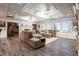 Cozy living room with comfortable sectional sofa, hardwood floors, and a fireplace at 1886 Chedworth Ct, Stone Mountain, GA 30087