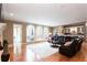 Spacious living room with hardwood floors, fireplace, and large windows to deck at 1886 Chedworth Ct, Stone Mountain, GA 30087