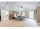 Primary bedroom with recessed lights, tray ceiling, and sitting area at 1886 Chedworth Ct, Stone Mountain, GA 30087