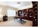 Home office featuring custom built-in shelves and a wooden executive desk at 1886 Chedworth Ct, Stone Mountain, GA 30087