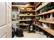 Organized storage room with ample shelving for decorations and seasonal items at 1886 Chedworth Ct, Stone Mountain, GA 30087