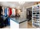 Well-organized closet with custom shelving, hanging racks and shoe storage at 1886 Chedworth Ct, Stone Mountain, GA 30087