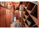 Rustic wine cellar featuring extensive shelving and a brick-lined archway at 1886 Chedworth Ct, Stone Mountain, GA 30087