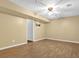 Finished basement features neutral paint and modern ceiling fan at 2865 Maple Vista Ln, Lawrenceville, GA 30044