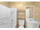Bathroom featuring modern tub, storage shelving, and vanity at 2865 Maple Vista Ln, Lawrenceville, GA 30044