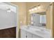 Bathroom boasting a double vanity, mirror, and access to an adjacent bedroom at 2865 Maple Vista Ln, Lawrenceville, GA 30044