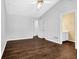 Bedroom showcasing a vaulted ceiling, hardwood floors, and ensuite bathroom access at 2865 Maple Vista Ln, Lawrenceville, GA 30044
