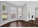 Sunlit breakfast nook featuring large windows, hardwood flooring, and modern trim at 2865 Maple Vista Ln, Lawrenceville, GA 30044