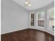 Light filled dining room featuring hardwood floors, neutral paint, and large windows at 2865 Maple Vista Ln, Lawrenceville, GA 30044