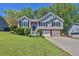 Charming two-story home features a well-maintained lawn and attached two car garage at 2865 Maple Vista Ln, Lawrenceville, GA 30044