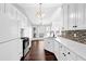 Bright kitchen with white cabinets, granite countertops, tiled backsplash, and stainless steel appliances at 2865 Maple Vista Ln, Lawrenceville, GA 30044