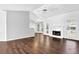 Bright living room with fireplace, hardwood floors, and large windows for lots of natural light at 2865 Maple Vista Ln, Lawrenceville, GA 30044