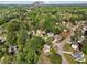 Panoramic aerial view of a suburban community with lush greenery and Stone Mountain in the background at 6960 Dockbridge Way, Stone Mountain, GA 30087
