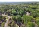 Aerial view of a beautiful community surrounded by lush, mature trees at 6960 Dockbridge Way, Stone Mountain, GA 30087