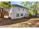 Back exterior featuring a deck, siding, and large windows at 6960 Dockbridge Way, Stone Mountain, GA 30087