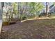 Lawn and backyard area with wooden back deck, perfect for outdoor activities at 6960 Dockbridge Way, Stone Mountain, GA 30087