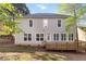 Two-story house featuring a wooden deck, large windows and neutral color at 6960 Dockbridge Way, Stone Mountain, GA 30087