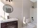 Bathroom boasts modern vanity, mirror, and vanity lighting fixtures at 6960 Dockbridge Way, Stone Mountain, GA 30087