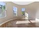 Bright bedroom with curved walls, hardwood floors, and natural light from three large windows at 6960 Dockbridge Way, Stone Mountain, GA 30087