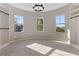 Unwind in this expansive bonus room boasting natural light and neutral paint at 6960 Dockbridge Way, Stone Mountain, GA 30087