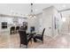 Open concept living space connects the modern kitchen to the dining and living areas at 6960 Dockbridge Way, Stone Mountain, GA 30087