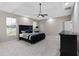 This primary bedroom offers great natural lighting with the large windows and recessed lighting at 6960 Dockbridge Way, Stone Mountain, GA 30087