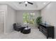 Cozy sitting area showcases a window with natural views and modern decor at 6960 Dockbridge Way, Stone Mountain, GA 30087