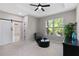 Spacious sitting area features a window with natural light and modern decor at 6960 Dockbridge Way, Stone Mountain, GA 30087