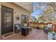 Inviting outdoor deck with comfortable seating and string lights, perfect for relaxing and entertaining at 11570 Dunhill Place Dr, Johns Creek, GA 30005