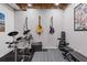 Renovated basement with musical instruments and work out area, perfect for creative and fitness pursuits at 11570 Dunhill Place Dr, Johns Creek, GA 30005