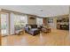 Comfortable basement living area with plush seating, ample natural light, and backyard access at 11570 Dunhill Place Dr, Johns Creek, GA 30005