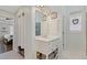 Bathroom boasts a vanity sink with a mirror, storage shelves, and an adjacent bedroom at 11570 Dunhill Place Dr, Johns Creek, GA 30005