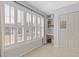 Bright bedroom features plantation shutters and built-in shelving for ample storage at 11570 Dunhill Place Dr, Johns Creek, GA 30005