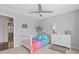 Cozy bedroom features soft carpet, neutral paint, and a whimsical decor at 11570 Dunhill Place Dr, Johns Creek, GA 30005