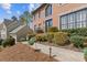 Charming two-story brick home with manicured landscaping and a welcoming entrance at 11570 Dunhill Place Dr, Johns Creek, GA 30005