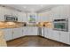 A gourmet kitchen with stainless steel appliances, tile backsplash, and granite countertops at 11570 Dunhill Place Dr, Johns Creek, GA 30005