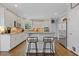 Open kitchen design features a central island, stainless steel appliances, and bar stool seating at 11570 Dunhill Place Dr, Johns Creek, GA 30005
